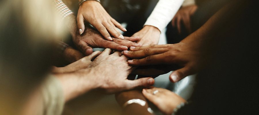 Closeup Diverse People Joining Their Hands